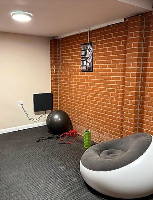 The activity room at Hammond House, set up with gym equipment.