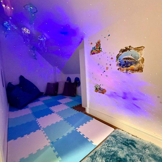 The mindfulness room under cool blue light, showing its colour-changing lighting.
